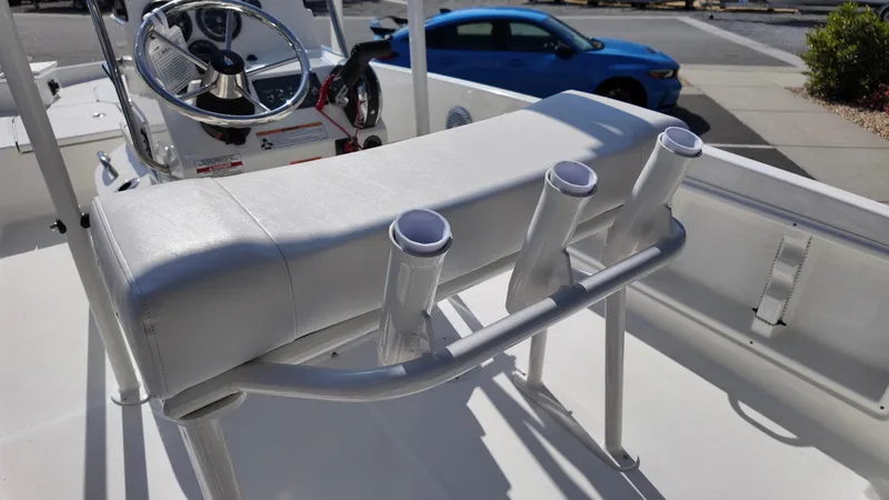Slide: The Image of 2025 Bayliner T18 Limited Edition boat interior with rod holders and steering wheel. - 8
