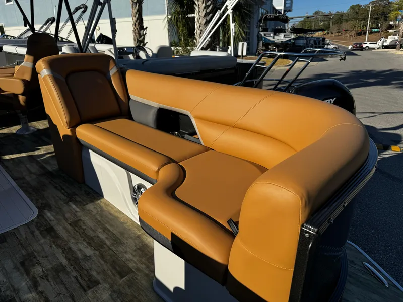 Slide: The Image of 2024 Crest Caribbean LX 230 boat dashboard with steering wheel and control panel. - 13