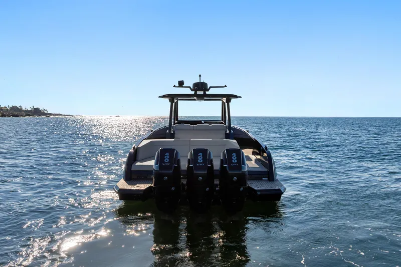 Slide: The Image of 2024 Vanquish Yachts VQ40 on open water, showcasing powerful engines and sleek design. - 13