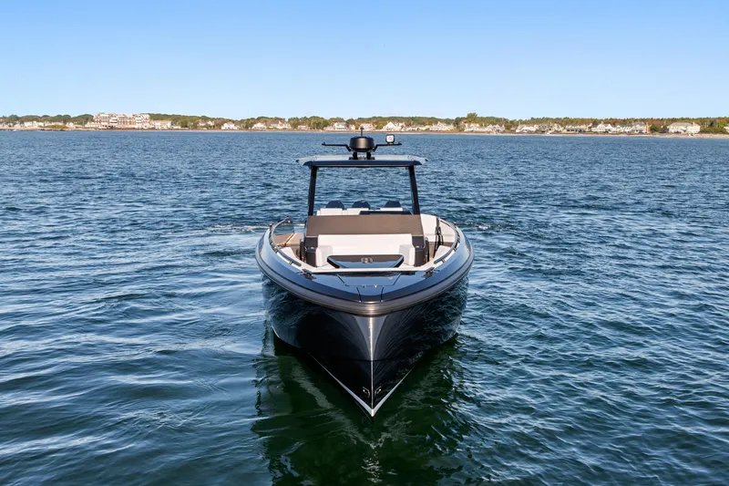 Slide: The Image of 2024 Vanquish Yachts VQ40 luxury yacht on open water, clear sky background. - 16