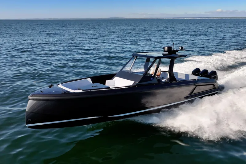 Slide: The Image of 2024 Vanquish Yachts VQ40 cruising on open water, showcasing sleek design and powerful performance. - 8