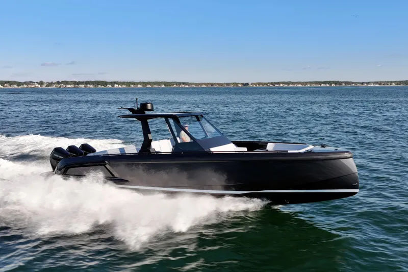 Slide: The Image of 2024 Vanquish Yachts VQ40 cruising on open water, showcasing sleek design and powerful performance. - 9