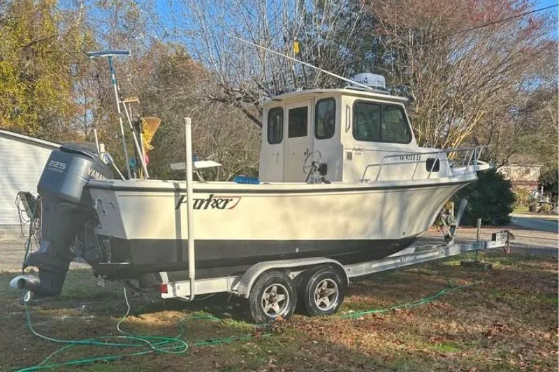 Slide: The Image of 2001 Parker 2320 Sport Cabin boat on trailer, parked outdoors. - 2