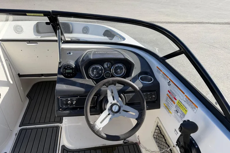 Slide: The Image of 2021 Bayliner VR5 Bowrider OB dashboard with steering wheel and control panel. - 3