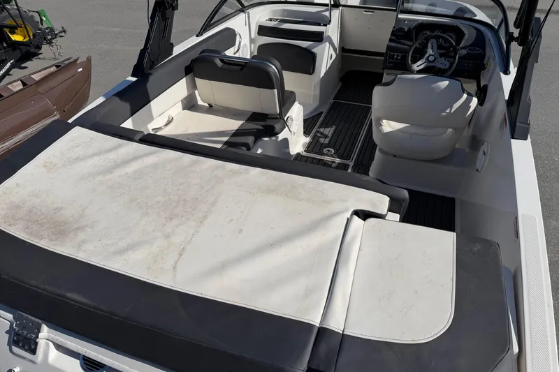 Slide: The Image of 2021 Bayliner VR5 Bowrider OB interior with seating and steering wheel. - 5