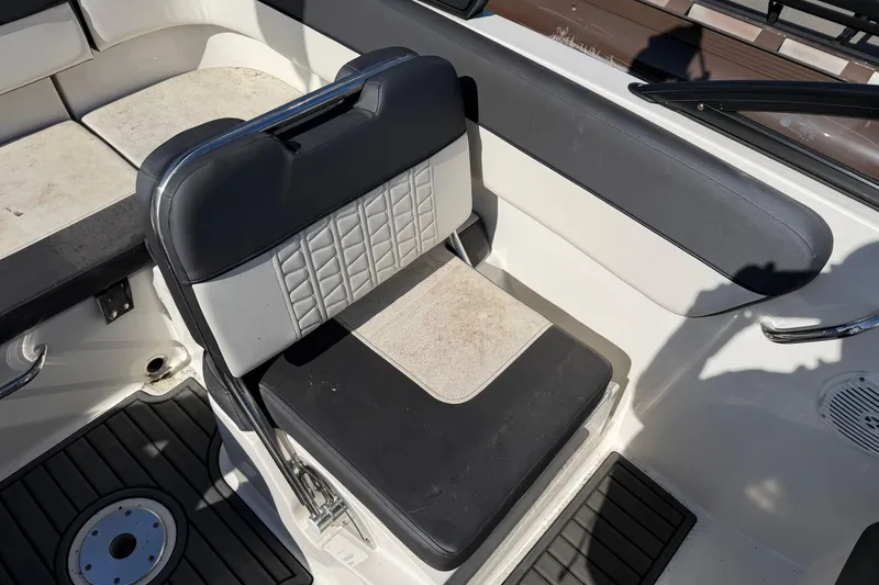 Slide: The Image of 2021 Bayliner VR5 Bowrider OB interior seating with black and white upholstery. - 6