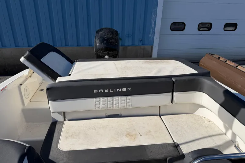 Slide: The Image of 2021 Bayliner VR5 Bowrider OB boat interior with seating and engine view. - 8