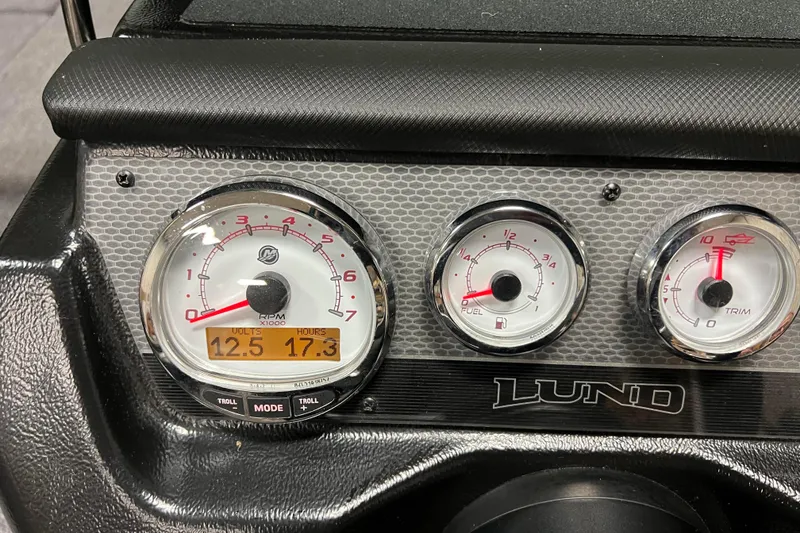 Slide: The Image of Dashboard of 2023 Lund 2175 Pro-V boat with RPM, fuel, and trim gauges. - 12