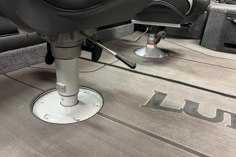 Slide: The Image of 2023 Lund 2175 Pro-V boat interior with adjustable seating and sleek flooring design. - 26