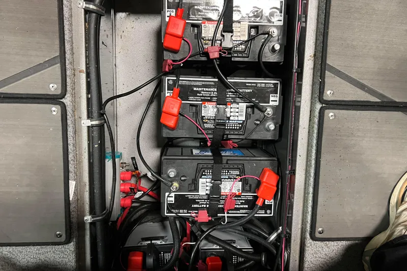 Slide: The Image of Batteries in a 2023 Lund 2175 Pro-V boat, showing wiring and connections. - 29