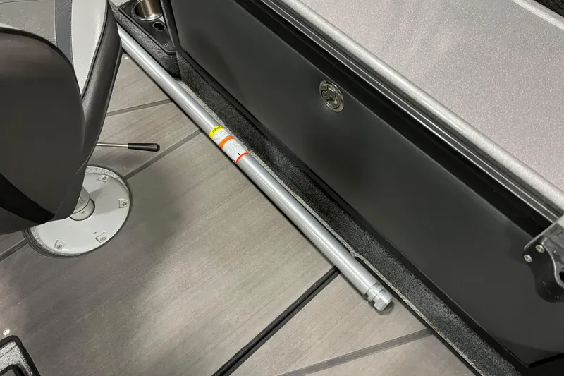 Slide: The Image of 2023 Lund 2175 Pro-V boat interior with seat and storage compartment. - 33