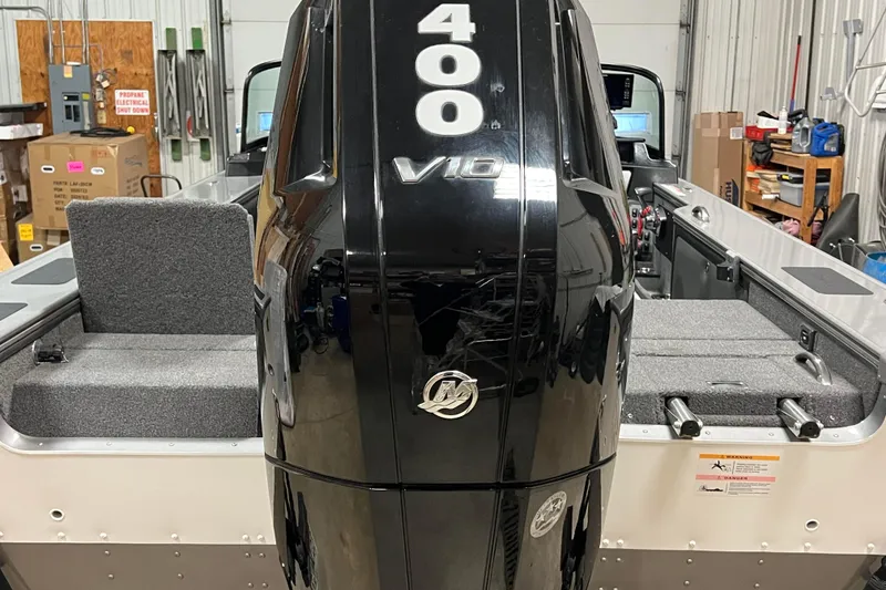 Slide: The Image of 2023 Lund 2175 Pro-V boat with powerful 400 V10 engine in a workshop setting. - 43