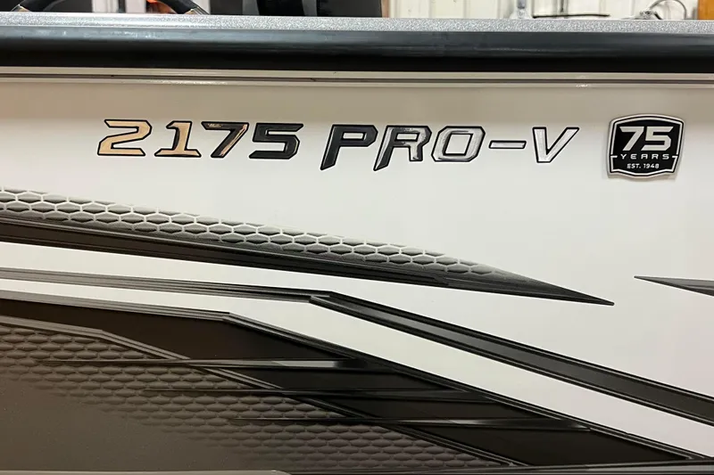 Slide: The Image of 2023 Lund 2175 Pro-V boat logo with 75th anniversary badge. - 45