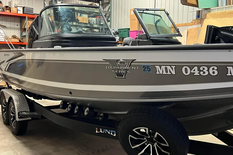 Slide: The Image of 2023 Lund 2175 Pro-V Tournament Series boat in a garage setting. - 53