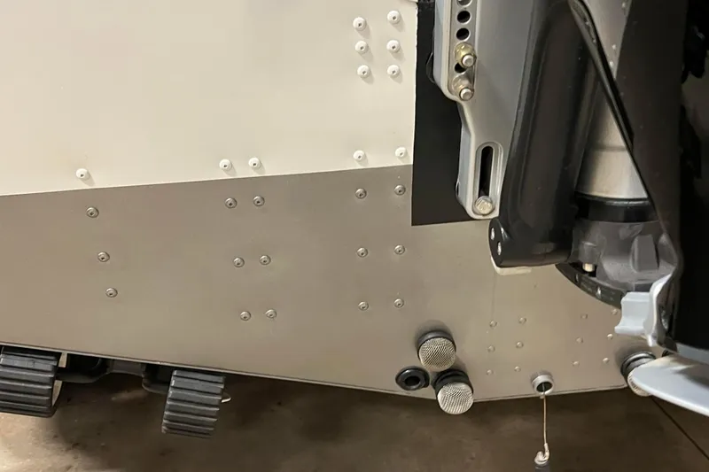 Slide: The Image of 2023 Lund 2175 Pro-V boat hull with rivets and motor mount details. - 62