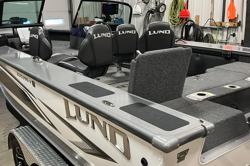 Slide: The Image of 2023 Lund 2175 Pro-V boat interior with branded seats and fishing deck. - 67