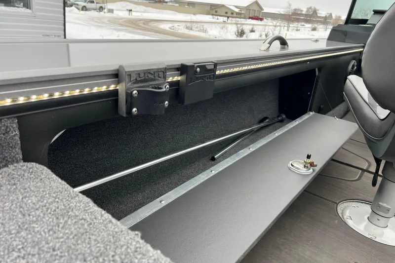 Slide: The Image of 2023 Lund 2175 Pro-V boat interior with storage compartment and seating. - 71