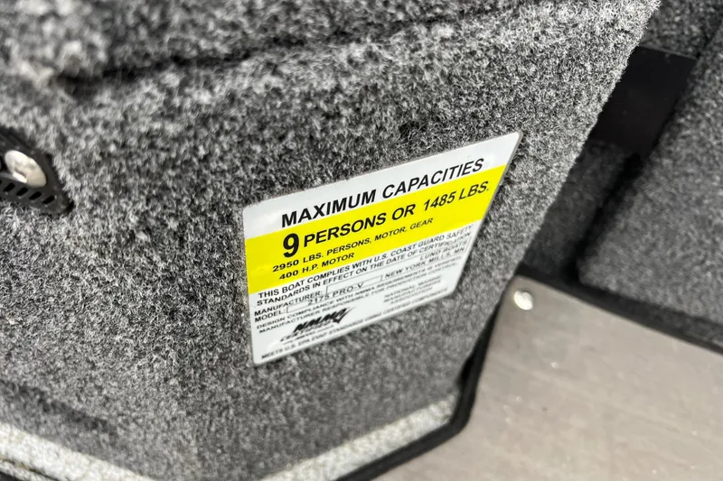 Slide: The Image of 2023 Lund 2175 Pro-V capacity label, maximum 9 persons or 1485 lbs. - 74
