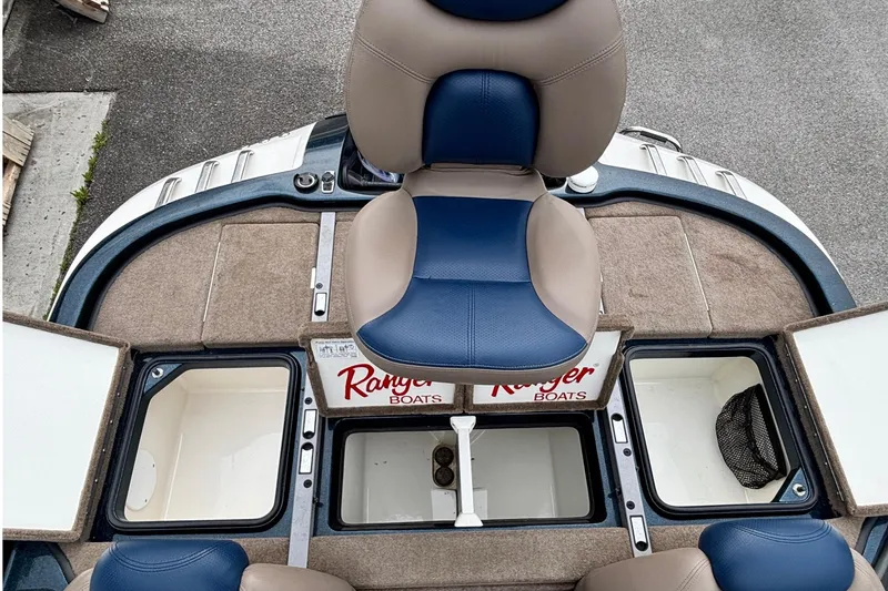 Slide: The Image of 2007 Ranger Z21 Comanche boat interior with seating and storage compartments. - 9