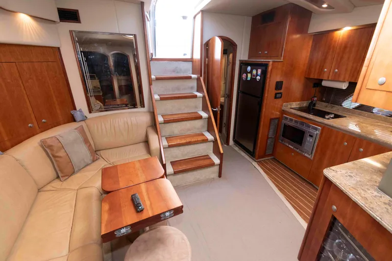 Slide: The Image of Luxurious interior of 2008 Cruisers Yachts 460 Express with elegant wood finishes and cozy seating. - 13