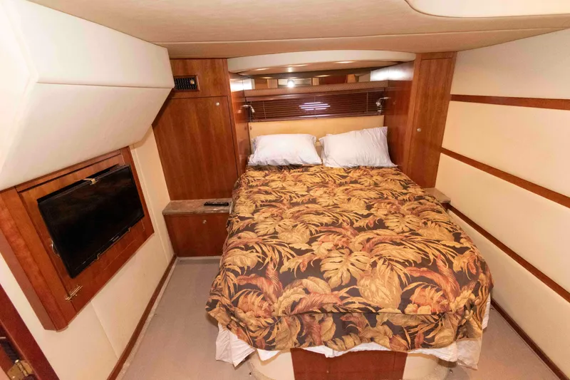 Slide: The Image of Luxurious cabin interior of 2008 Cruisers Yachts 460 Express with cozy bed and TV. - 14