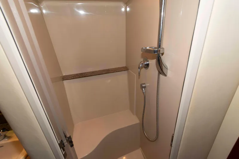 Slide: The Image of Shower area in 2008 Cruisers Yachts 460 Express, featuring modern fixtures and seating. - 17