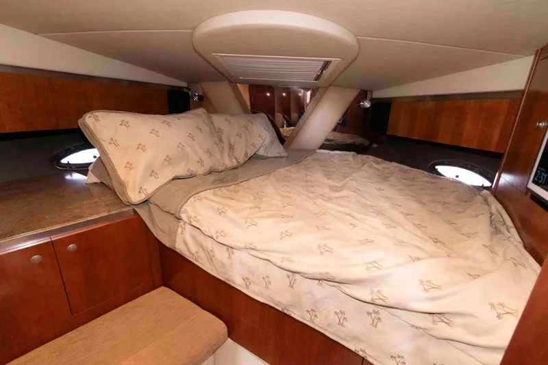 Slide: The Image of Luxurious cabin interior of 2008 Cruisers Yachts 460 Express with cozy bedding. - 19