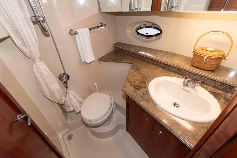 Slide: The Image of Luxurious bathroom in 2008 Cruisers Yachts 460 Express, featuring elegant fixtures and marble countertop. - 20