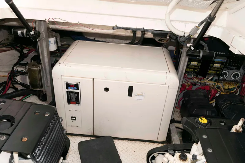 Slide: The Image of Engine room of 2008 Cruisers Yachts 460 Express with generator and wiring. - 24