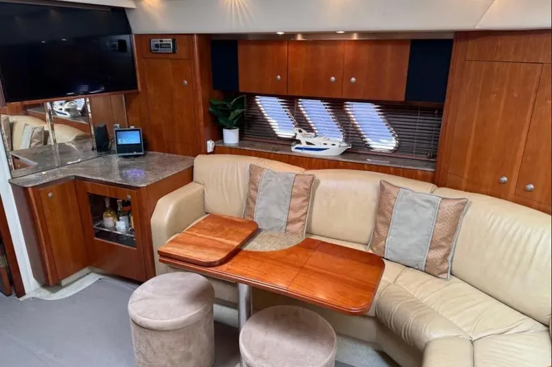 Slide: The Image of Luxurious 2008 Cruisers Yachts 460 Express interior with leather seating and wooden accents. - 4