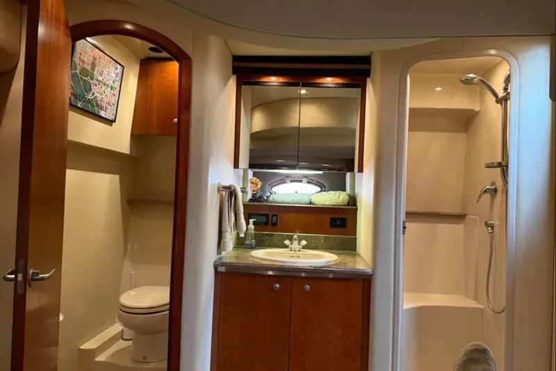 Slide: The Image of Luxurious 2008 Cruisers Yachts 460 Express bathroom with shower, sink, and toilet. - 7