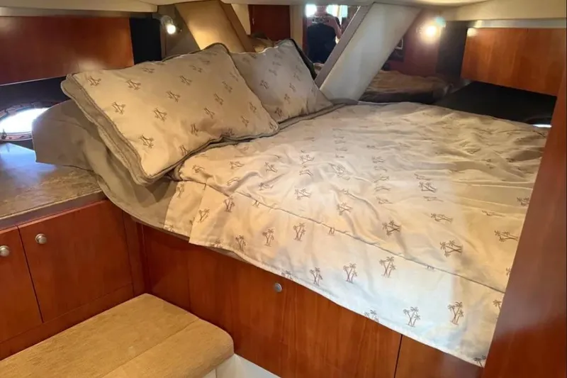Slide: The Image of Luxurious cabin interior of 2008 Cruisers Yachts 460 Express with cozy bedding. - 8