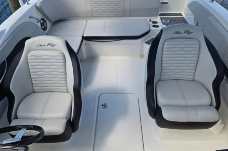 Slide: The Image of 2023 Sea Ray SPX 210 boat interior with two plush seats and sleek design. - 18