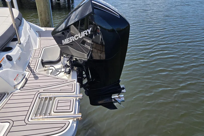 Slide: The Image of 2023 Sea Ray SPX 210 boat with Mercury outboard motor on water. - 28