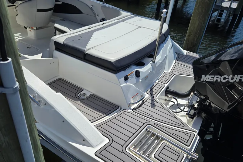 Slide: The Image of 2023 Sea Ray SPX 210 boat with Mercury engine, featuring sleek deck design and comfortable seating. - 29