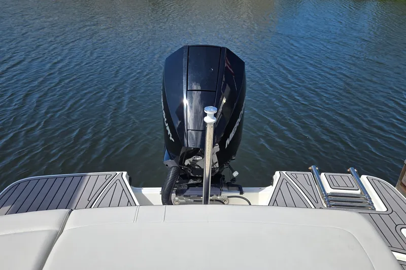 Slide: The Image of 2023 Sea Ray SPX 210 boat with Mercury outboard motor on calm water. - 31