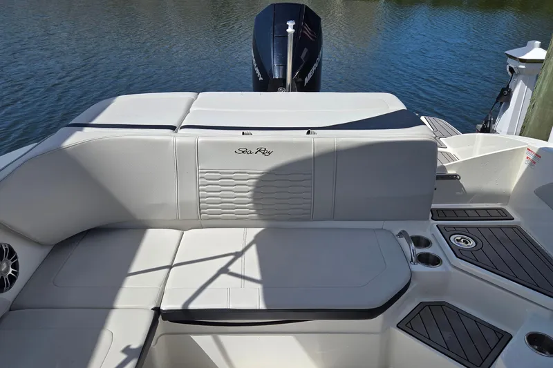 Slide: The Image of 2023 Sea Ray SPX 210 boat interior with comfortable seating and sleek design. - 32