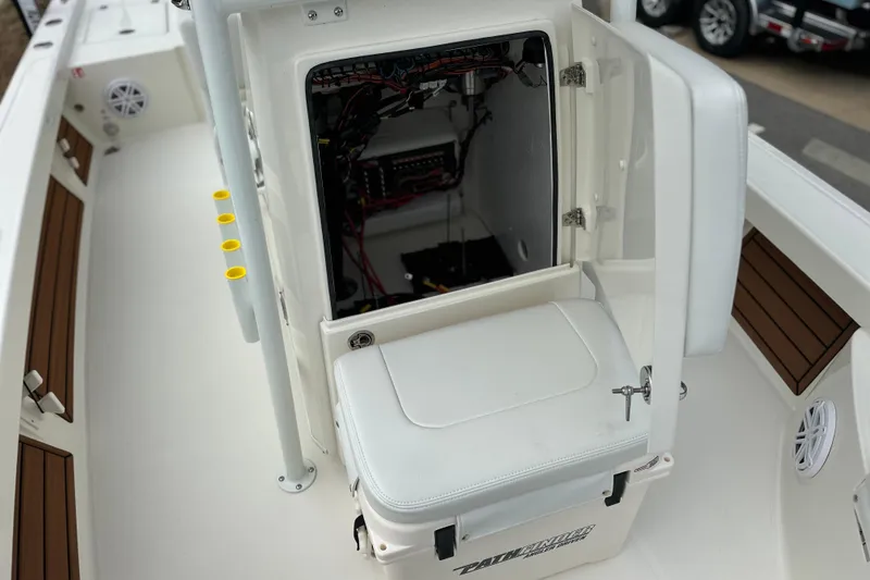 Slide: The Image of 2026 Pathfinder 2200 TRS boat interior with open storage compartment and seating. - 14