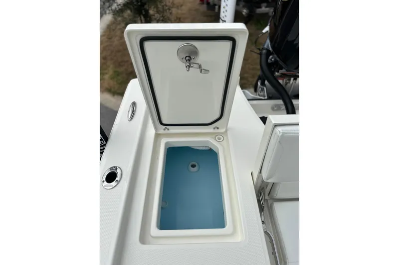 Slide: The Image of Open storage compartment on 2026 Pathfinder 2200 TRS boat, featuring a sleek design. - 15