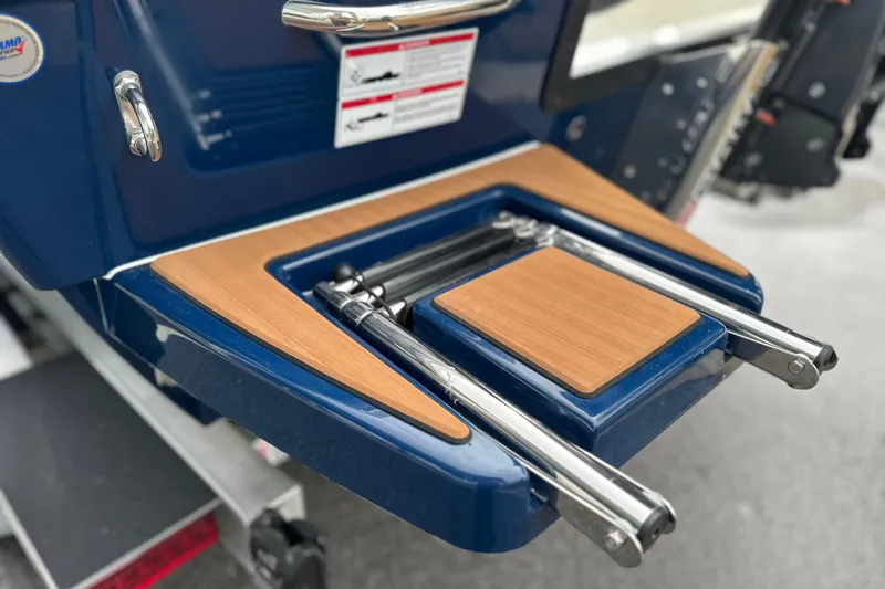 Slide: The Image of 2026 Pathfinder 2200 TRS boat with teak swim platform and stainless steel ladder. - 19