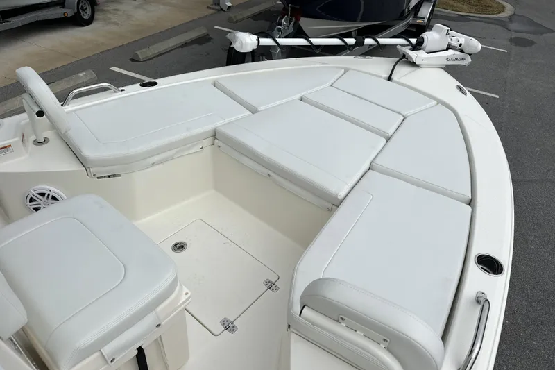 Slide: The Image of 2026 Pathfinder 2200 TRS boat with cushioned seating and Garmin equipment. - 2
