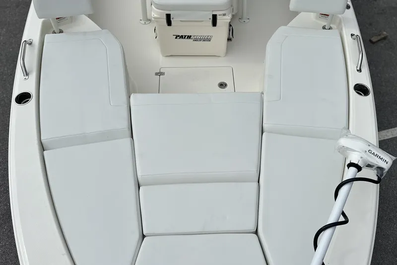 Slide: The Image of 2026 Pathfinder 2200 TRS boat interior with cushioned seating and Garmin equipment. - 3