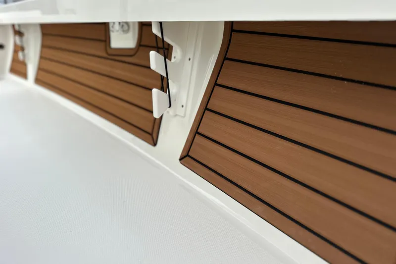 Slide: The Image of 2026 Pathfinder 2200 TRS boat interior with sleek wood paneling and modern design. - 6