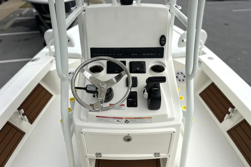 Slide: The Image of 2026 Pathfinder 2200 TRS boat console with steering wheel and controls. - 7