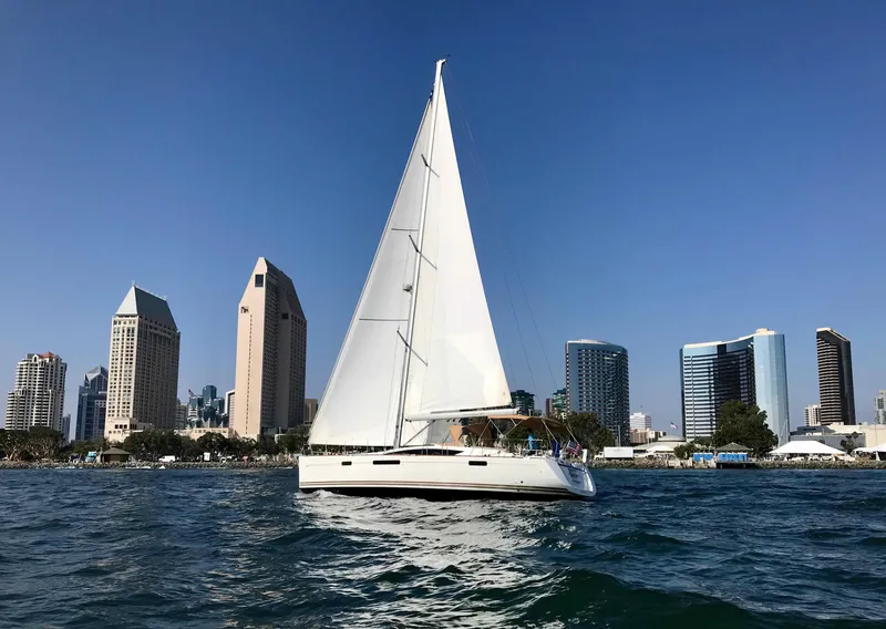 Slide: The Image of Jeanneau 57 sailboat cruising near city skyline, 2014 model. - 1