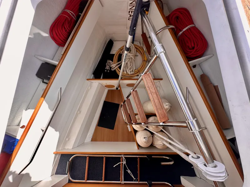 Slide: The Image of Interior view of 2014 Jeanneau 57 sailboat with ropes and wooden steps. - 44