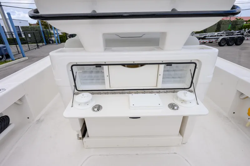Slide: The Image of 2024 SeaVee 270Z boat interior with storage compartments and fishing rod holders. - 13