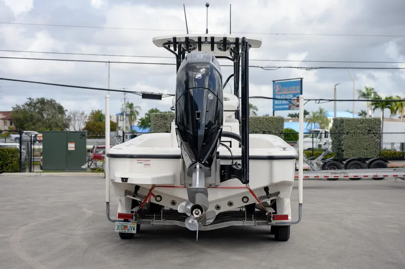 Slide: The Image of 2024 SeaVee 270Z boat rear view with outboard motor in a parking lot. - 3