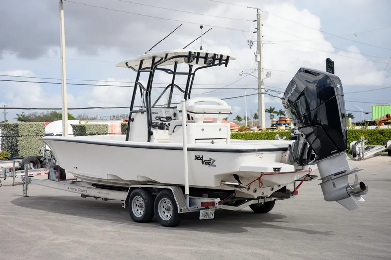 Slide: The Image of 2024 SeaVee 270Z boat on trailer, featuring a powerful outboard motor. - 5