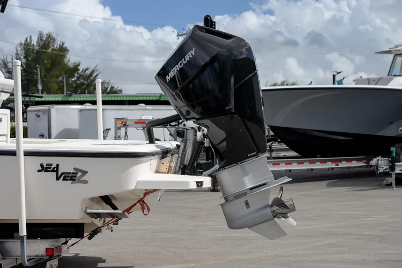Slide: The Image of 2024 SeaVee 270Z boat with Mercury outboard motor, parked on a trailer. - 6